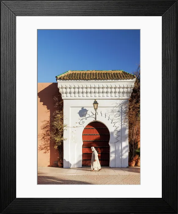Framed Print : Man in traditional dress walking in front of door at Koutoubia Mosque, Marrakech, Morocco Framed Print : Man in traditional dress walking in front of door at Koutoubia Mosque, Marrakech, Morocco