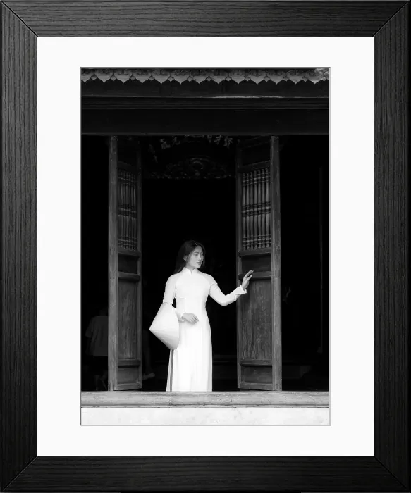 Framed Print : Local woman wearing tradtional Ao Dai dress and holding conical hat at The Temple of Literature, Hanoi, Vietnam Framed Print : Local woman wearing tradtional Ao Dai dress and holding conical hat at The Temple of Literature, Hanoi, Vietnam
