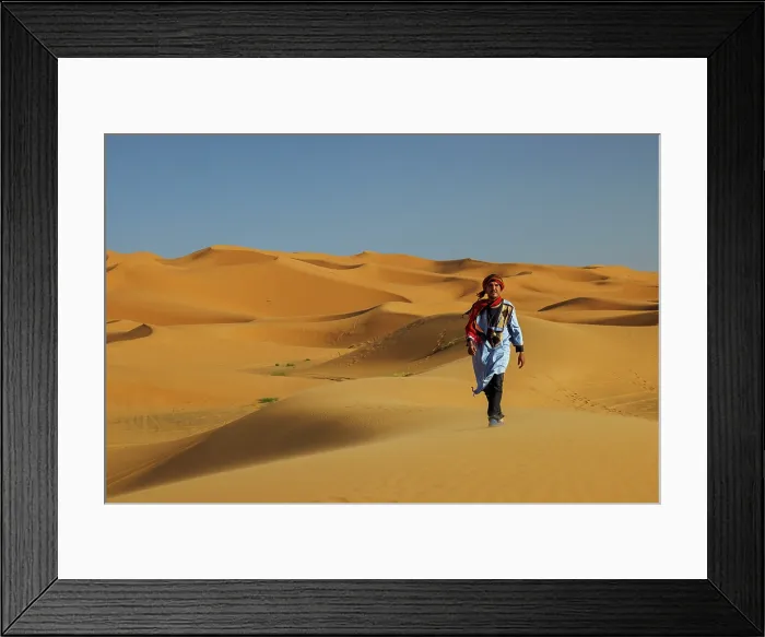 Framed Print : Berber man walking in the Erg Chebbi sand dunes, Sahara Desert, Merzouga, Morocco Framed Print : Berber man walking in the Erg Chebbi sand dunes, Sahara Desert, Merzouga, Morocco