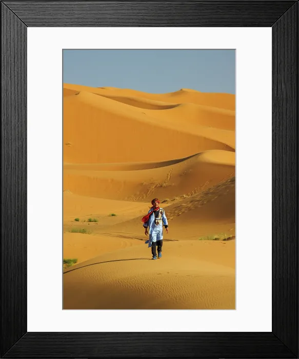 Framed Print : Berber man walking in the Erg Chebbi sand dunes, Sahara Desert, Merzouga, Morocco Framed Print : Berber man walking in the Erg Chebbi sand dunes, Sahara Desert, Merzouga, Morocco