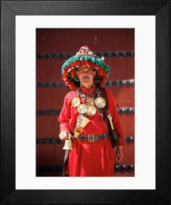 Framed Print : Portrait of waterseller in front of iconic door, Marrakech, Morocco Framed Print : Portrait of waterseller in front of iconic door, Marrakech, Morocco