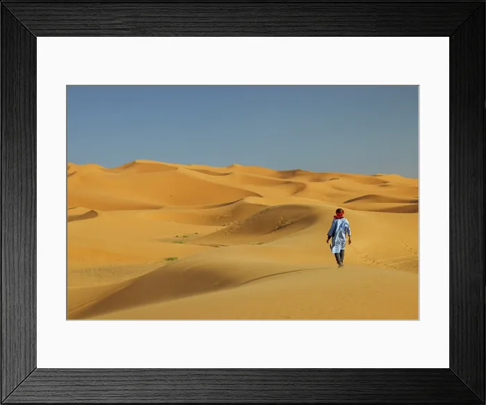 Framed Print : Berber man walking in the Erg Chebbi sand dunes, Sahara Desert, Merzouga, Morocco Framed Print : Berber man walking in the Erg Chebbi sand dunes, Sahara Desert, Merzouga, Morocco