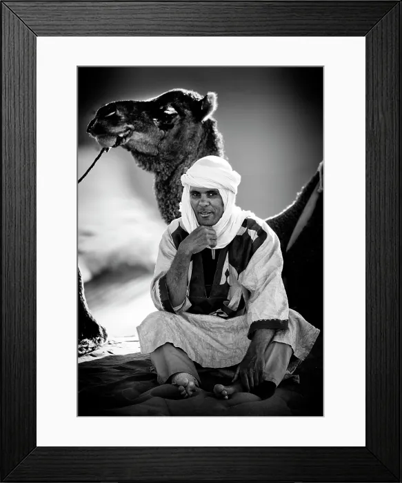 Framed Print : Portrait of a Berber man wearing traditional headscarf (Cheche), with his camel, Erg Chebbi, Sahara Desert, Merzouga Morocco Framed Print : Portrait of a Berber man wearing traditional headscarf (Cheche), with his camel, Erg Chebbi, Sahara Desert, Merzouga Morocco