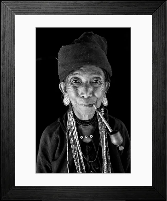 Framed Print : Woman of the Ann tribe in traditional black dress, smoking a pipe in a hill village near Kengtung (Kyaingtong), Shan State, Myanmar (Burma) Framed Print : Woman of the Ann tribe in traditional black dress, smoking a pipe in a hill village near Kengtung (Kyaingtong), Shan State, Myanmar (Burma)