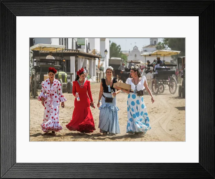 Framed Print : Roceras women pilgrims traditionally dressed walking in a street during the Romeria de El Rocio pilgrimage, El Rocio, Huelva, Andalusia, Spain Framed Print : Roceras women pilgrims traditionally dressed walking in a street during the Romeria de El Rocio pilgrimage, El Rocio, Huelva, Andalusia, Spain
