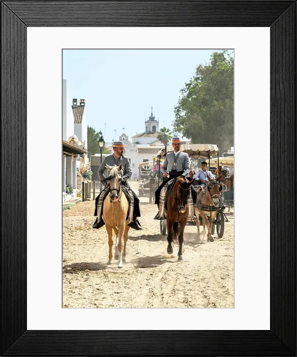 Framed Print : Horsemen riding in a street during the Romeria de El Rocio pilgrimage, El Rocio, Huelva, Andalusia, Spain Framed Print : Horsemen riding in a street during the Romeria de El Rocio pilgrimage, El Rocio, Huelva, Andalusia, Spain