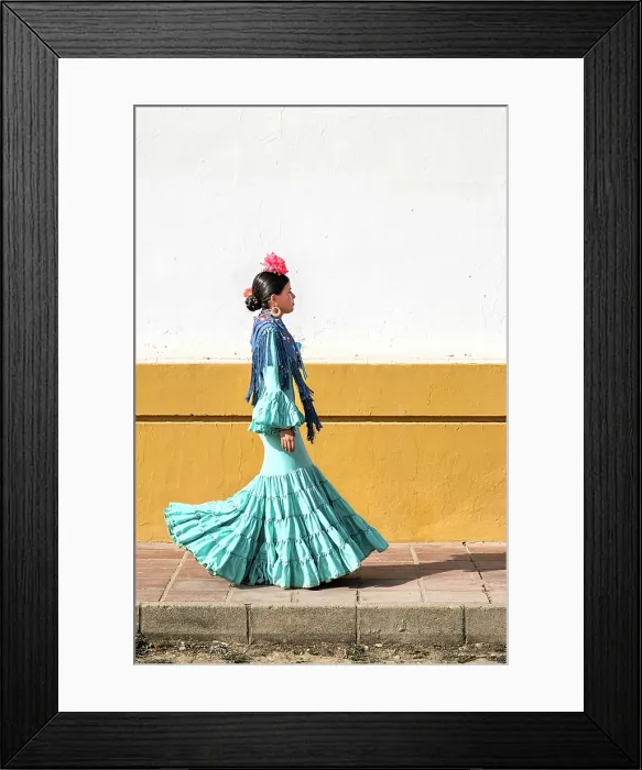 Framed Print : Woman traditionally dressed walking in a street during the El Rocio pilgrimage, El Rocio, Huelva, Andalusia, Spain