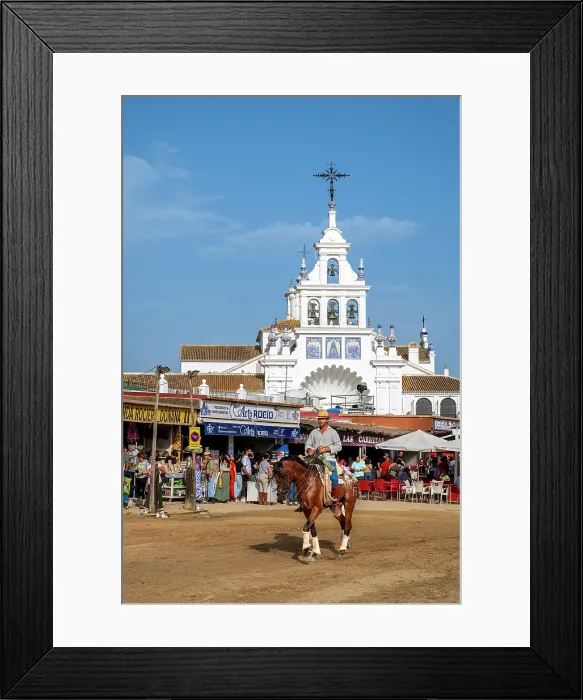 Framed Print : Horseman riding in a street with Ermita de la Virgen del Rocio in the background, El Rocio, Huelva, Andalusia, Spain Framed Print : Horseman riding in a street with Ermita de la Virgen del Rocio in the background, El Rocio, Huelva, Andalusia, Spain