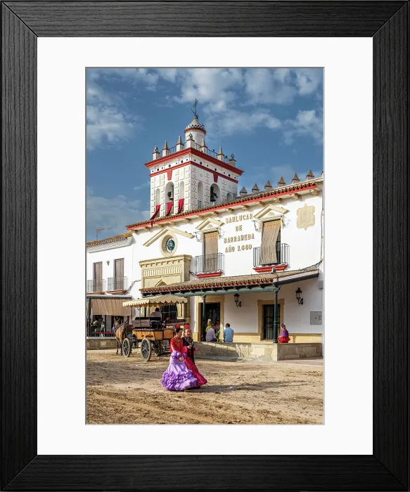 Framed Print : Women traditionally dressed walking in a street during the El Rocio pilgrimage, El Rocio, Huelva, Andalusia, Spain Framed Print : Women traditionally dressed walking in a street during the El Rocio pilgrimage, El Rocio, Huelva, Andalusia, Spain