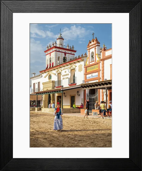 Framed Print : Woman traditionally dressed walking in a street during the El Rocio pilgrimage, El Rocio, Huelva, Andalusia, Spain Framed Print : Woman traditionally dressed walking in a street during the El Rocio pilgrimage, El Rocio, Huelva, Andalusia, Spain