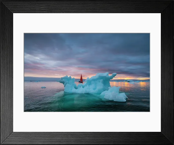 Framed Print : Red sailboat and blue iceberg at sunset in Disko Bay, Greenland Framed Print : Red sailboat and blue iceberg at sunset in Disko Bay, Greenland