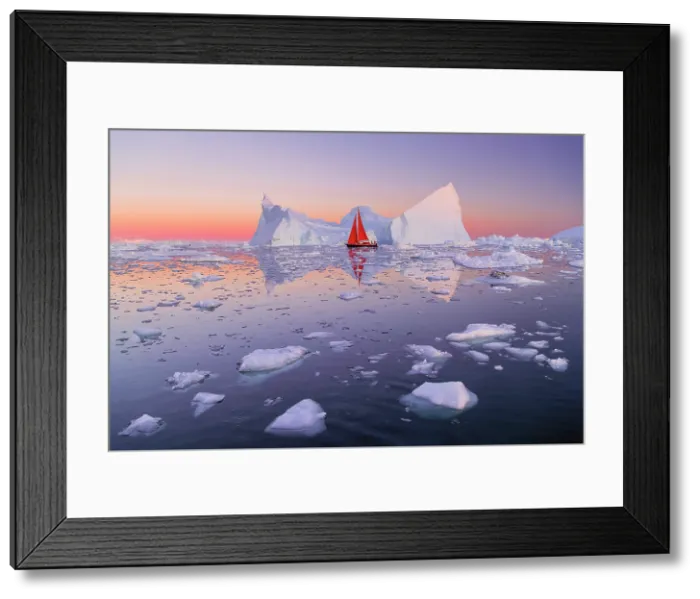 Framed Print : Red sailboat at dusk near icebergs in Disko Bay, Greenland Framed Print : Red sailboat at dusk near icebergs in Disko Bay, Greenland