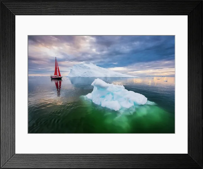 Framed Print : Red sailboat and blue iceberg at sunset in Disko Bay, Greenland Framed Print : Red sailboat and blue iceberg at sunset in Disko Bay, Greenland