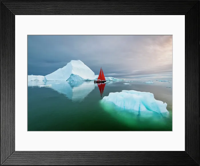 Framed Print : Blue iceberg and red sailboat in Disko Bay, Greenland Framed Print : Blue iceberg and red sailboat in Disko Bay, Greenland