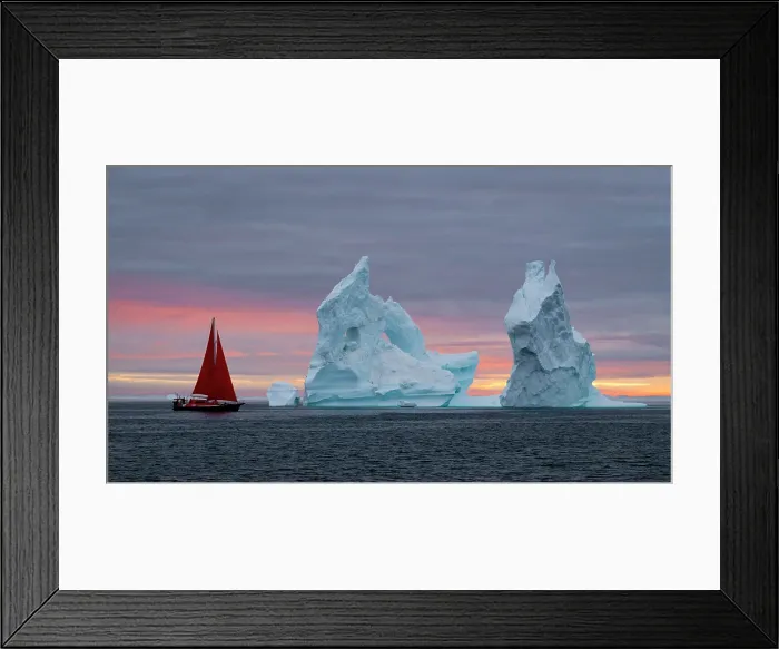 Framed Print : Red sailboat at sunset near icebergs in Disko Bay, Greenland Framed Print : Red sailboat at sunset near icebergs in Disko Bay, Greenland