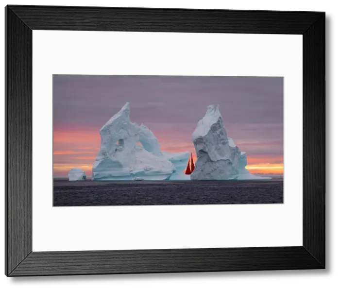 Framed Print : Red sails and icebergs at sunset in Disko Bay, Greenland Framed Print : Red sails and icebergs at sunset in Disko Bay, Greenland