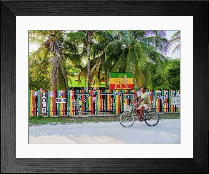 Framed Print : Man biking in front of the Rastafarian Community at Caye Caulker Village, Caye Caulker, Belize District, Belize Framed Print : Man biking in front of the Rastafarian Community at Caye Caulker Village, Caye Caulker, Belize District, Belize
