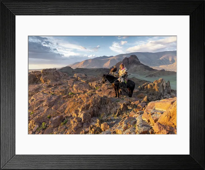 Framed Print : Kazakh Eagle Hunter on horseback wearing traditional fur clothing and posing with his trained golden eagle, Bayan-Ulgii Province, Western Mongolia Framed Print : Kazakh Eagle Hunter on horseback wearing traditional fur clothing and posing with his trained golden eagle, Bayan-Ulgii Province, Western Mongolia