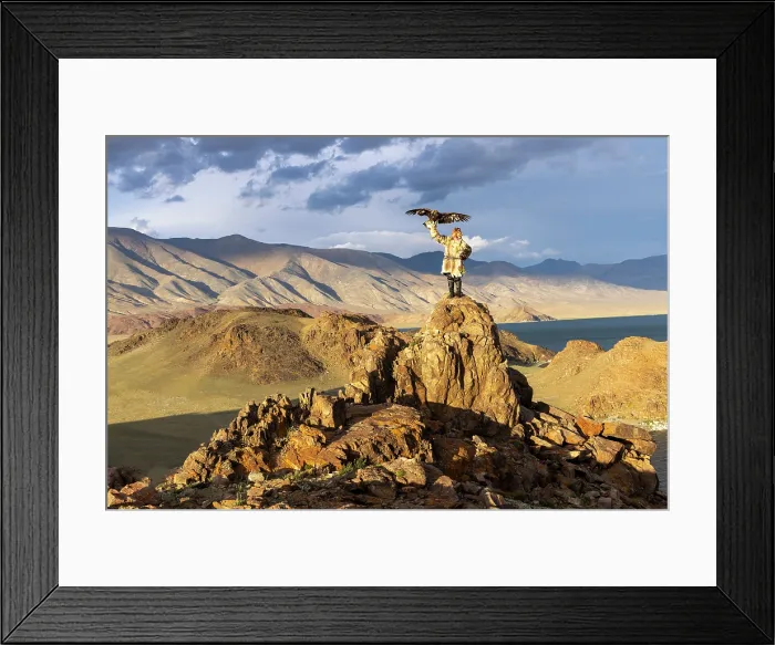 Framed Print : Kazakh Eagle Hunter wearing traditional fur clothing and posing with his trained golden eagle, Bayan-Ulgii Province, Western Mongolia Framed Print : Kazakh Eagle Hunter wearing traditional fur clothing and posing with his trained golden eagle, Bayan-Ulgii Province, Western Mongolia