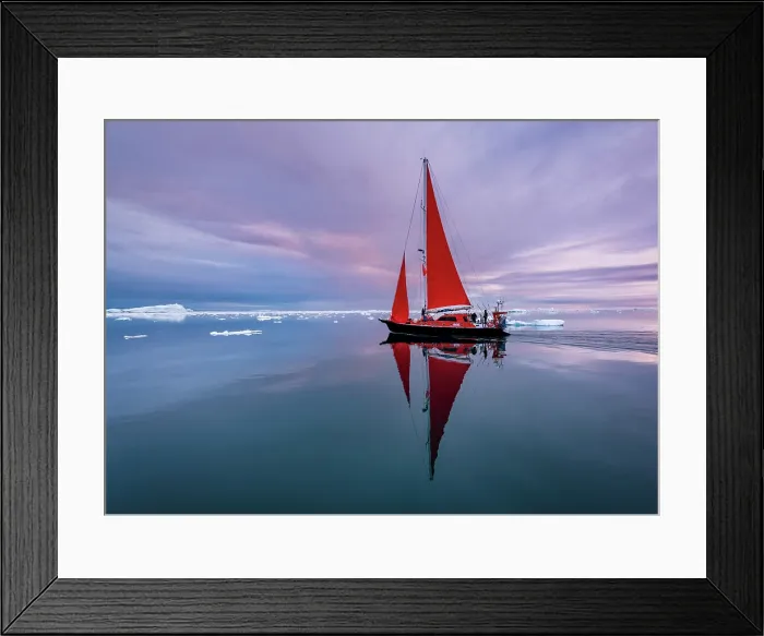 Framed Print : Red sailboat reflection near sunset on Disko Bay, Greenland Framed Print : Red sailboat reflection near sunset on Disko Bay, Greenland