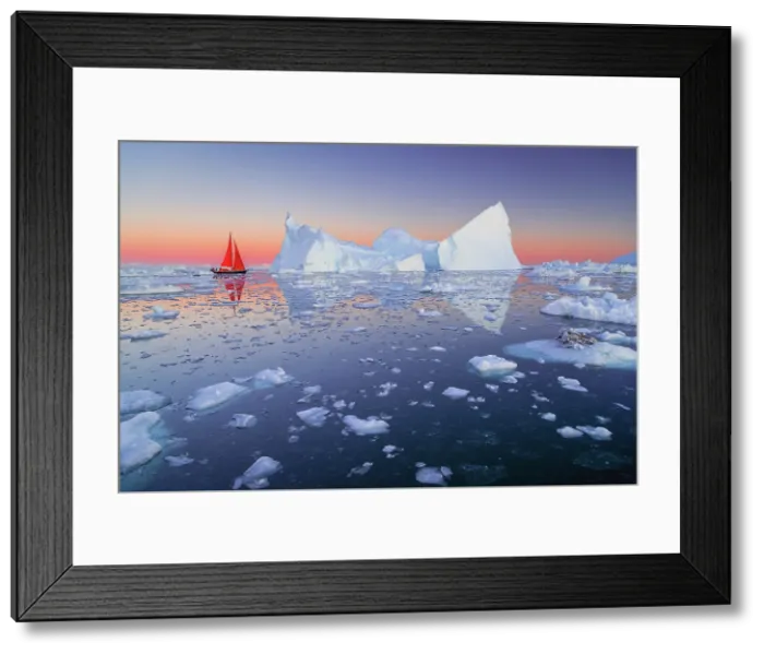 Framed Print : Red sailboat at dusk near icebergs in Disko Bay, Greenland Framed Print : Red sailboat at dusk near icebergs in Disko Bay, Greenland