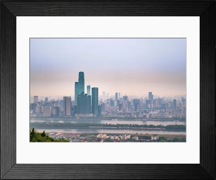 Framed Print : China, Hunan Province, Changsha City. Provincial capital of Hunan Province. City skyline showing skyscrapers, modern buildings and the Xiang River Framed Print : China, Hunan Province, Changsha City. Provincial capital of Hunan Province. City skyline showing skyscrapers, modern buildings and the Xiang River