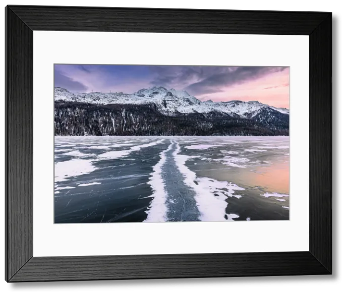 Framed Print : Colors of sunset is reflected on the frozen surface of Lej da Silvaplana. Engadine Valley, Graubunden Canton, Switzerland Framed Print : Colors of sunset is reflected on the frozen surface of Lej da Silvaplana. Engadine Valley, Graubunden Canton, Switzerland