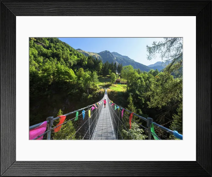 Framed Print : A child crosses the tibetan bridge of Fraciscio, Campodolcino, Spluga valley, Sondrio province, Lombardy, Italy (MR)