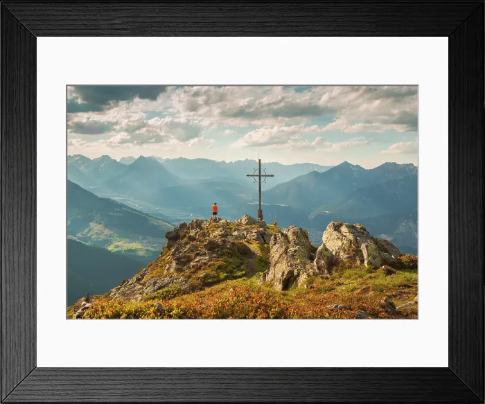 Framed Print : A mountaineer enjoying the Inn Valley from the summit of Axamer Kogele mountain, Axams, Innsbruck Land, Tyrol, Austria Framed Print : A mountaineer enjoying the Inn Valley from the summit of Axamer Kogele mountain, Axams, Innsbruck Land, Tyrol, Austria