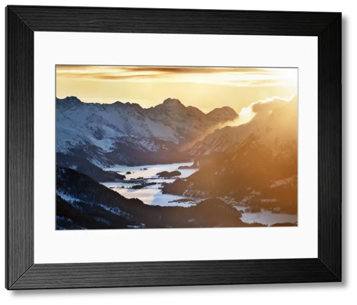 Framed Print : Engadine valley with lakes of Sils, Selvaplana and Sankt Morits covered by snow, at sunset. Graubunden Canton, Switzerland Framed Print : Engadine valley with lakes of Sils, Selvaplana and Sankt Morits covered by snow, at sunset. Graubunden Canton, Switzerland