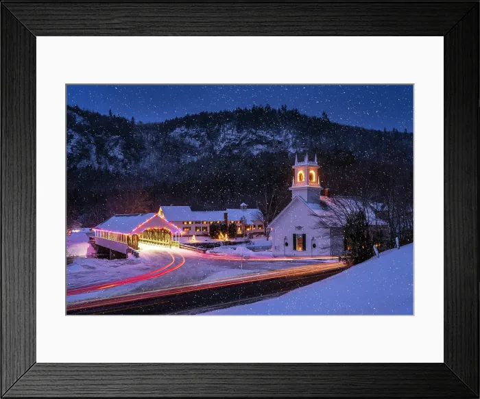 Framed Print : White-steeple church and covered bridge in winter with holiday lights and light trails, Stark, New Hampshire, USA