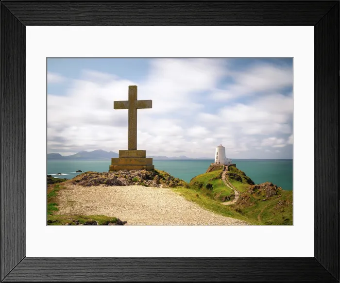Framed Print : A cross and Twr Mawr lighthouse on Llanddwyn Island in Anglesey, Wales Framed Print : A cross and Twr Mawr lighthouse on Llanddwyn Island in Anglesey, Wales