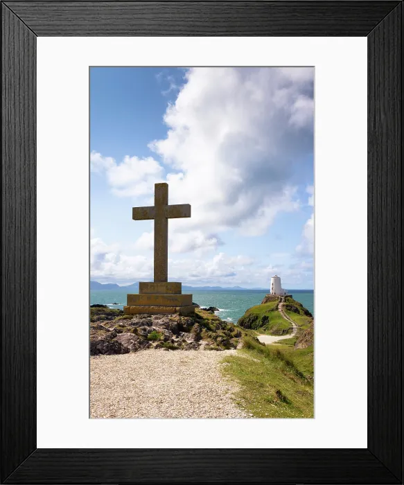 Framed Print : A cross and Twr Mawr lighthouse on Llanddwyn Island in Anglesey, Wales Framed Print : A cross and Twr Mawr lighthouse on Llanddwyn Island in Anglesey, Wales