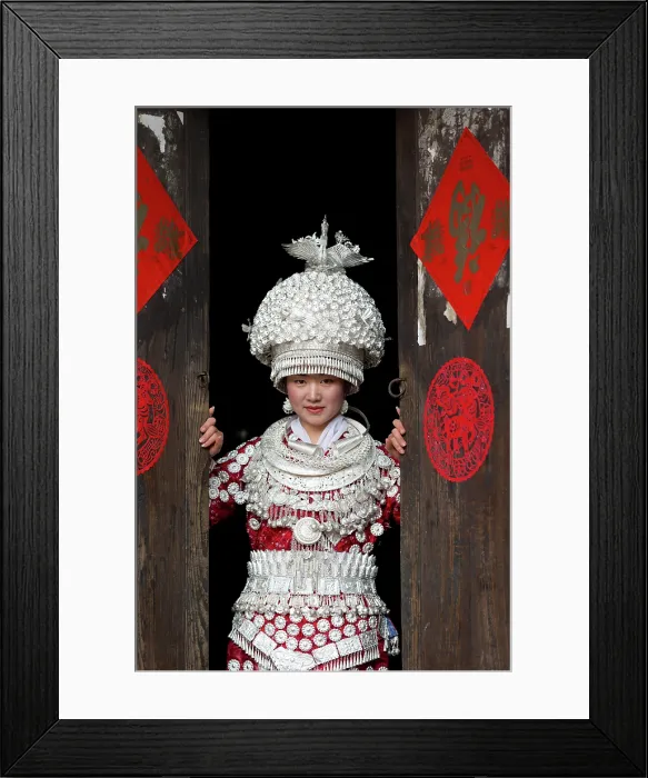 Framed Print : China, Zhonghua, Guizhou, Miao woman dressed in traditional costume, wearing a hat that weighs 5 kgs Framed Print : China, Zhonghua, Guizhou, Miao woman dressed in traditional costume, wearing a hat that weighs 5 kgs