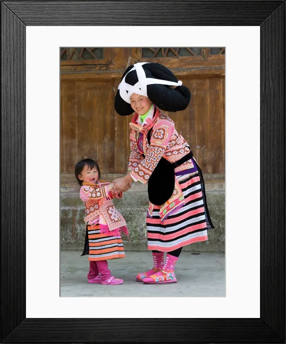 Framed Print : China, Zhonghua, Guizhou, Long-horned Miao woman playing with her daughter Framed Print : China, Zhonghua, Guizhou, Long-horned Miao woman playing with her daughter