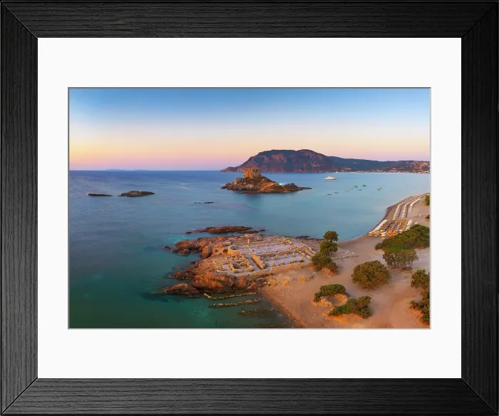 Framed Print : Greece, Dodecanese, Kos Island, Kamari Bay, Agios Stefanos Beach, Saint Stefanos Basilica Ruins and Kastri Island at sunset