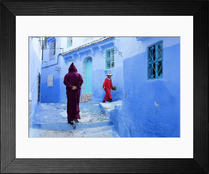 Framed Print : Africa, Morocco, Rif Mountains, Chefchaouen, Traditionally dressed locals walking in the blue streets Framed Print : Africa, Morocco, Rif Mountains, Chefchaouen, Traditionally dressed locals walking in the blue streets