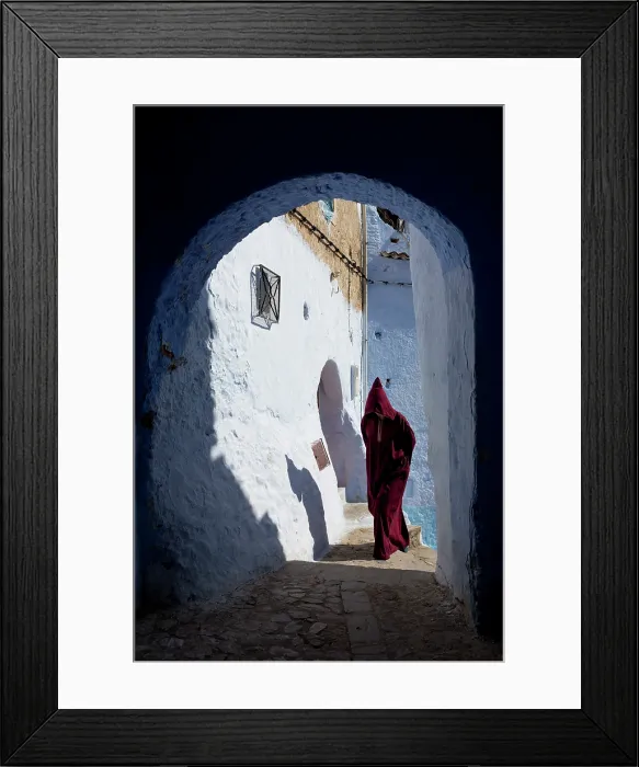 Framed Print : Africa, Morocco, Rif Mountains, Chefchaouen, Traditionally dressed berber walking through a passageway Framed Print : Africa, Morocco, Rif Mountains, Chefchaouen, Traditionally dressed berber walking through a passageway