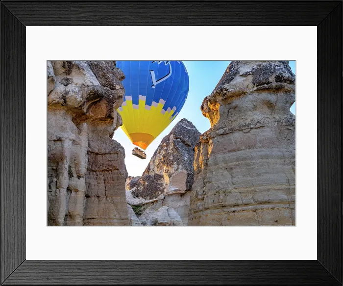 Framed Print : Hot air balloon flying between rock formations, Love Valley, Goreme National Park, Cappadocia, Central Anatolia, Turkey Framed Print : Hot air balloon flying between rock formations, Love Valley, Goreme National Park, Cappadocia, Central Anatolia, Turkey