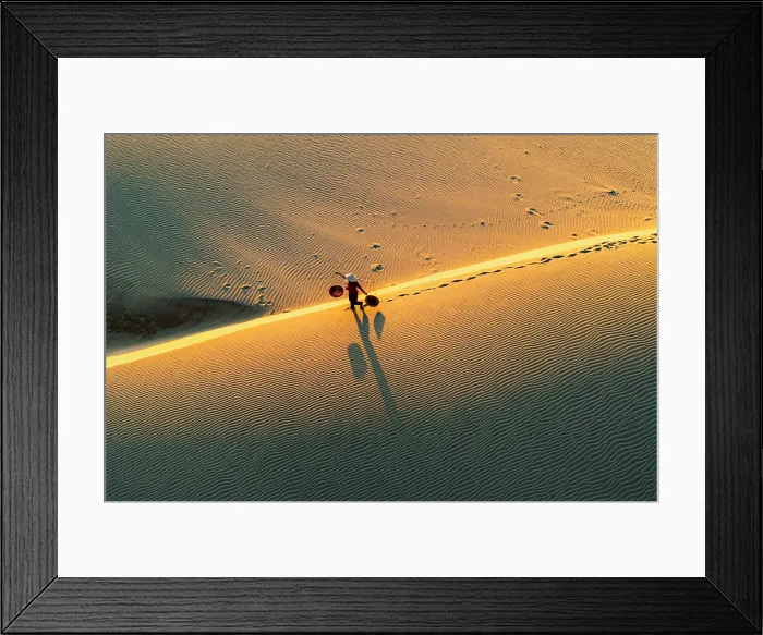 Framed Print : Woman with basket on golden dunes at dawn, Nam Cuong, Ninh Thuan Province, Vietnam. (MR) Framed Print : Woman with basket on golden dunes at dawn, Nam Cuong, Ninh Thuan Province, Vietnam. (MR)