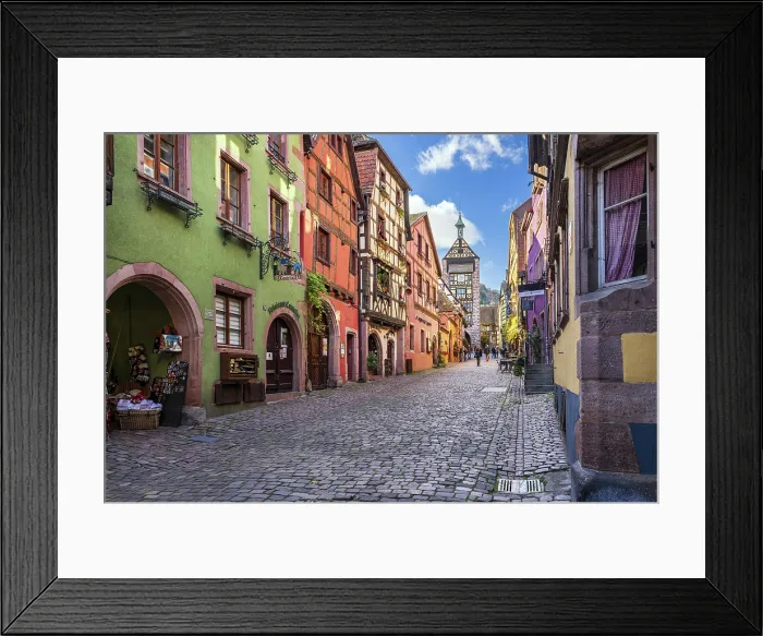 Framed Print : Main street with traditional half-timbered houses and Dolder watchtower, Riquewihr, Haut-Rhin, Alsace, Grand Est, France Framed Print : Main street with traditional half-timbered houses and Dolder watchtower, Riquewihr, Haut-Rhin, Alsace, Grand Est, France