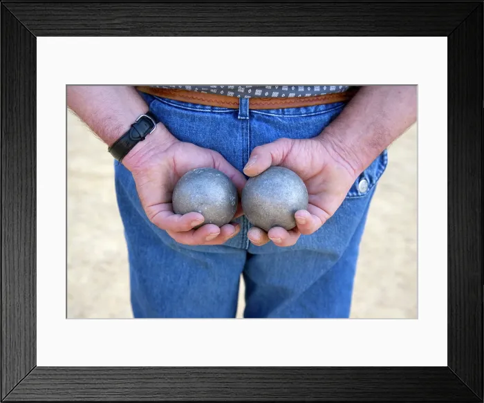 Framed Print : A man holds two boules whilst he plays petanque, Dordogne, Nouvelle-Aquitaine, France Framed Print : A man holds two boules whilst he plays petanque, Dordogne, Nouvelle-Aquitaine, France