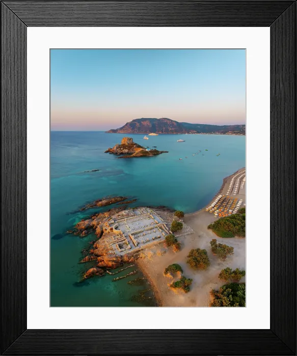 Framed Print : Greece, Dodecanese, Kos Island, Kamari Bay, Agios Stefanos Beach, Saint Stefanos Basilica Ruins and Kastri Island at sunset Framed Print : Greece, Dodecanese, Kos Island, Kamari Bay, Agios Stefanos Beach, Saint Stefanos Basilica Ruins and Kastri Island at sunset