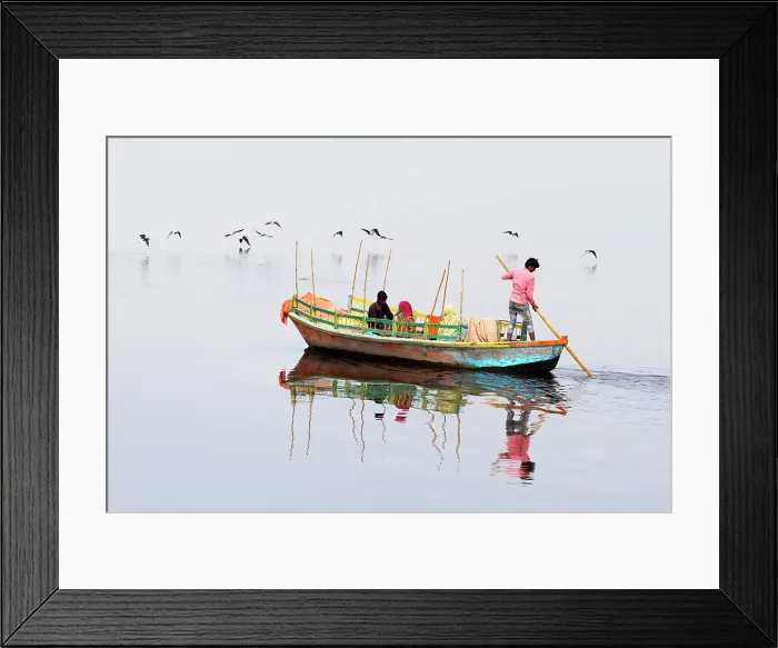 Framed Print : India, Uttar Pradesh, Mathura, Vrindavan, A ferryboat carrying passengers crosses the Yamuna river