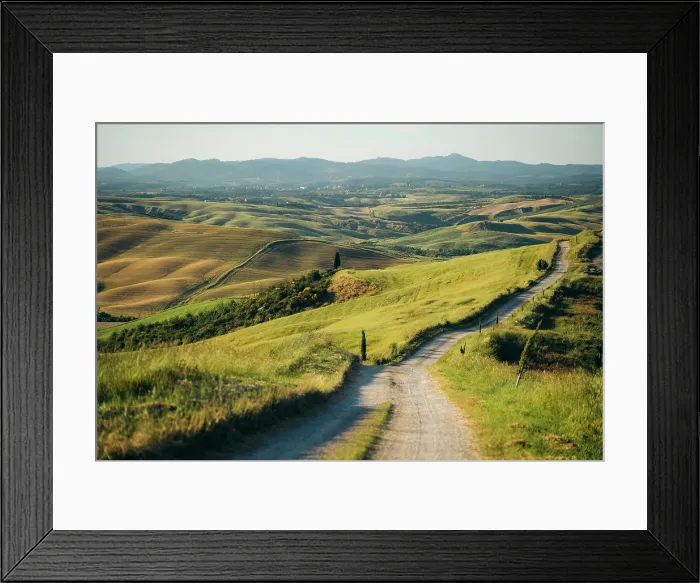Framed Print : Crete Senesi, Tuscany, Italy: Winding road through rolling hills and farmland Framed Print : Crete Senesi, Tuscany, Italy: Winding road through rolling hills and farmland