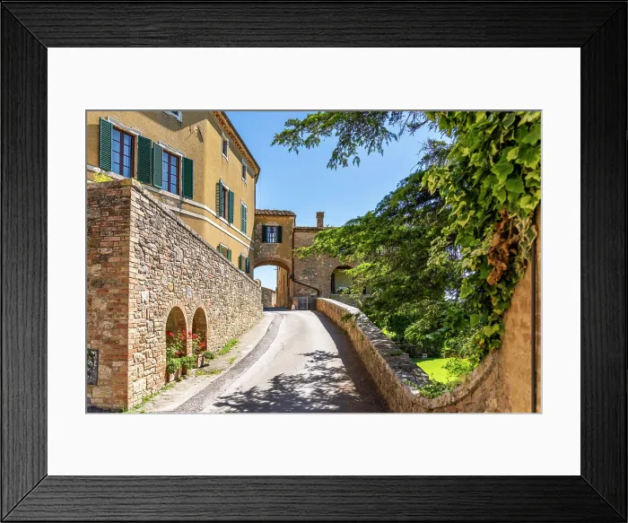 Framed Print : Lucignano D'Asso, Tuscany, Italy: Street scene with buildings and archway on a sunny day Framed Print : Lucignano D'Asso, Tuscany, Italy: Street scene with buildings and archway on a sunny day