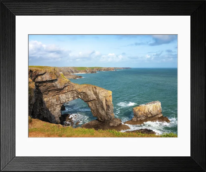 Framed Print : View towards the Green Bridge of Wales, a natural arch formed from limestone within the Pembrokeshire Coast National Park, Pembrokeshire, Wales Framed Print : View towards the Green Bridge of Wales, a natural arch formed from limestone within the Pembrokeshire Coast National Park, Pembrokeshire, Wales