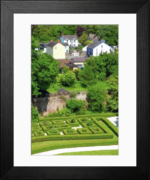 Framed Print : Laugharne Castle (Castell Talacharn) walled garden as seen from the castle walls, with the town of Laugharne in the background, Carmarthenshire, Wales Framed Print : Laugharne Castle (Castell Talacharn) walled garden as seen from the castle walls, with the town of Laugharne in the background, Carmarthenshire, Wales
