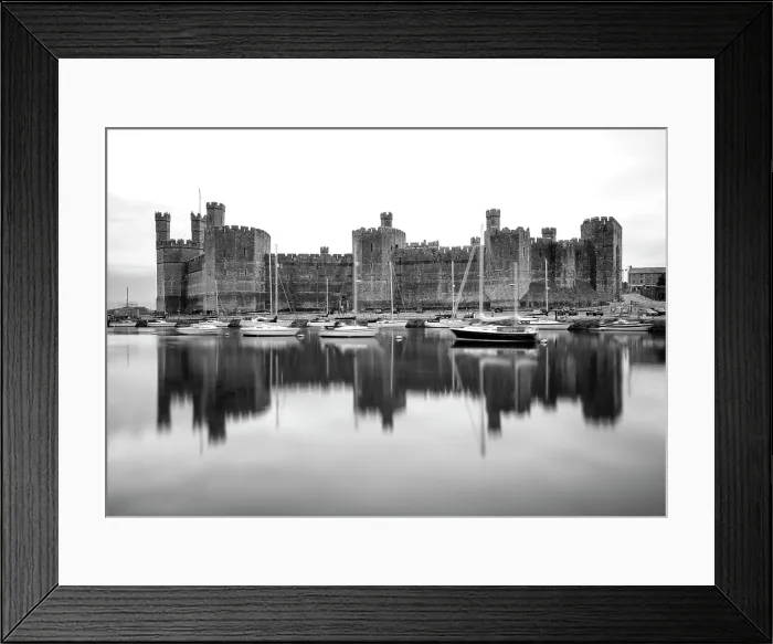 Framed Print : Caernarfon Castle (Castell Caernarfon) reflected in Afon Seiont, Caernarfon, Gwynedd, Wales