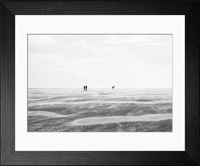 Framed Print : A couple playing with their dog on the vast expanse of Whiteford Sands beach, Gower Peninsula, Swansea, Wales Framed Print : A couple playing with their dog on the vast expanse of Whiteford Sands beach, Gower Peninsula, Swansea, Wales